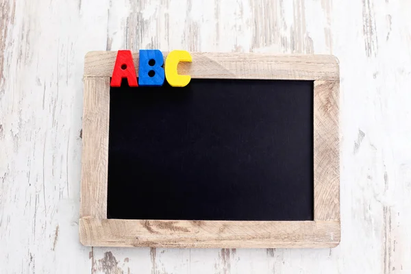 Wooden alphabet blocks as a frame — Stock Photo, Image