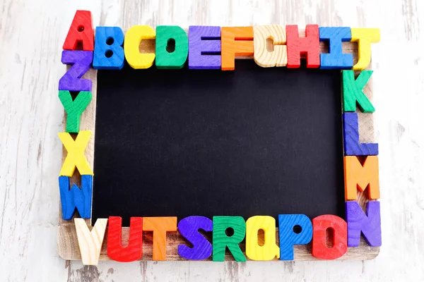 Wooden alphabet blocks as a frame — Stock Photo, Image