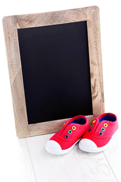 Frame en baby schoenen advertentie — Stockfoto