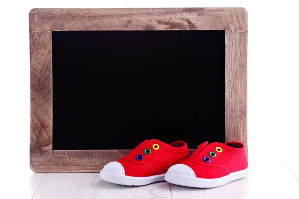 Frame en baby schoenen advertentie — Stockfoto