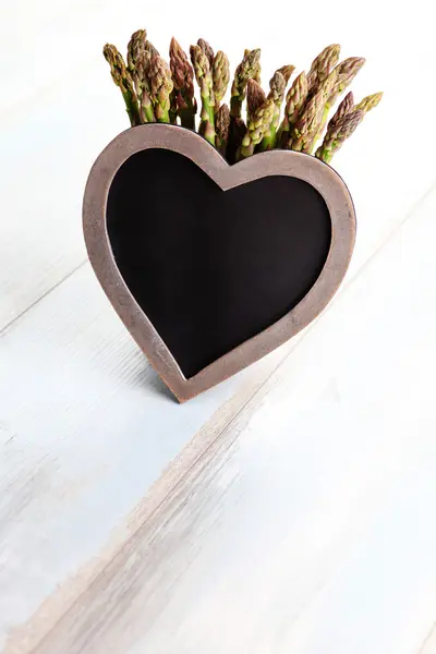 Bunch of asparagus with heart — Stock Photo, Image