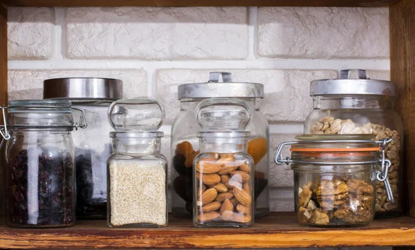 Jars with dried fruits and nuts — Stock Photo, Image