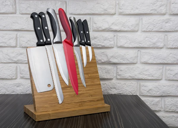 Set of knives on magnetic holder — Stock Photo, Image