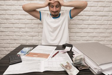 man during filling Tax Forms clipart