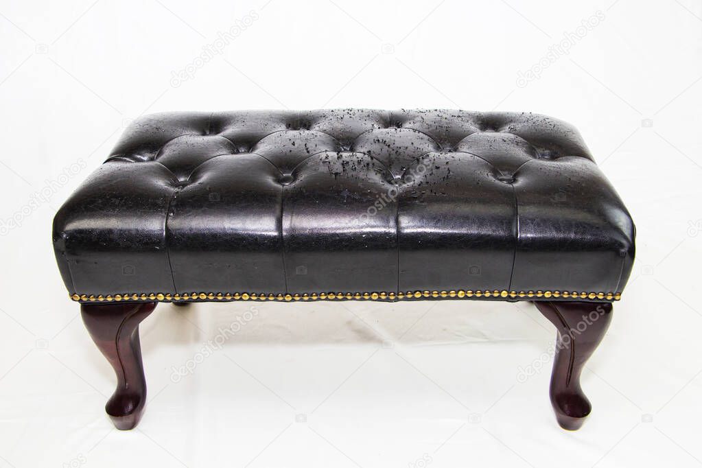 black leather background with damaged surface, furniture repair.