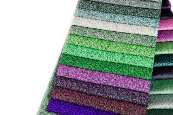 A set of fabric samples for furniture finishing. Multicolored upholstery stripes