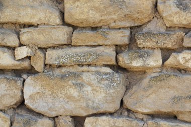 Vahşi taş duvarın kaba dokulu yüzeyi. Arkaplan