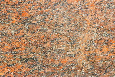 Granit yüzey arka plan olarak kırmızıdır. Doğal taş.