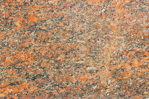 Granit yüzey arka plan olarak kırmızıdır. Doğal taş.