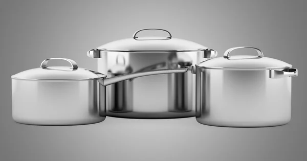 Three cooking pans isolated on gray background — Stock Photo, Image