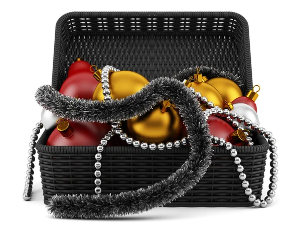 Black basket with christmas decorations isolated on white backgr — Stock Photo, Image
