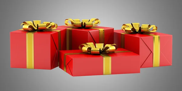 Cajas de regalo rojas con cintas doradas aisladas sobre fondo gris — Foto de Stock