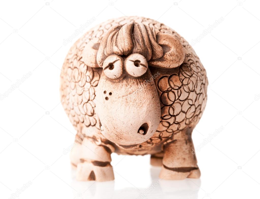 brown ceramic sheep statuette isolated on white background