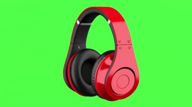 Kırmızı ve siyah kablosuz kulaklık döndürme yeşil chromakey arka plan üzerinde döngü