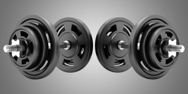 İki dambıl gri arka plan üzerinde izole