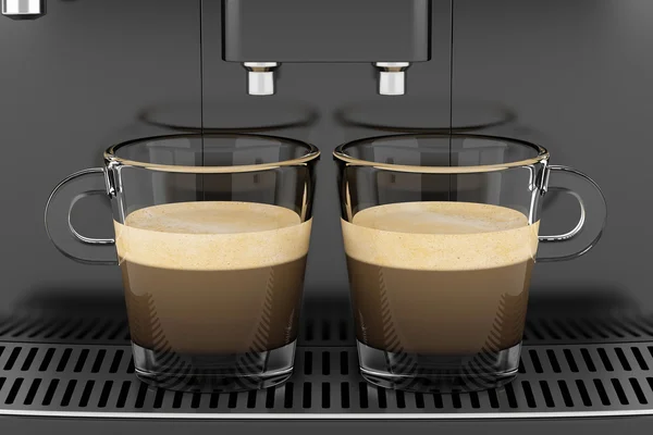 Dos tazas con café de pie en la máquina de café negro — Foto de Stock