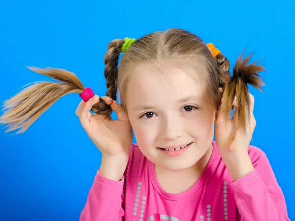 The young girl shows two braids — Stock Photo, Image