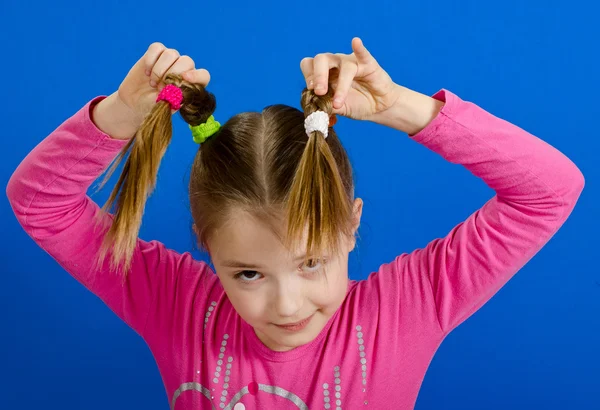 The young girl shows two braids — Stock Photo, Image