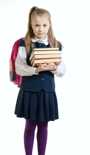 The girl in a school uniform with books — Stock Photo, Image