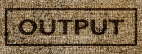 A sign saying "OUTPUT" on a piece of old canvas — Stock Photo, Image