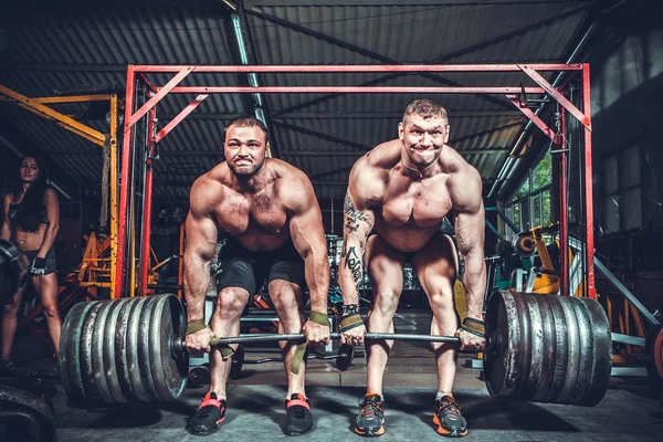 Powerlifters levantando pesas —  Fotos de Stock