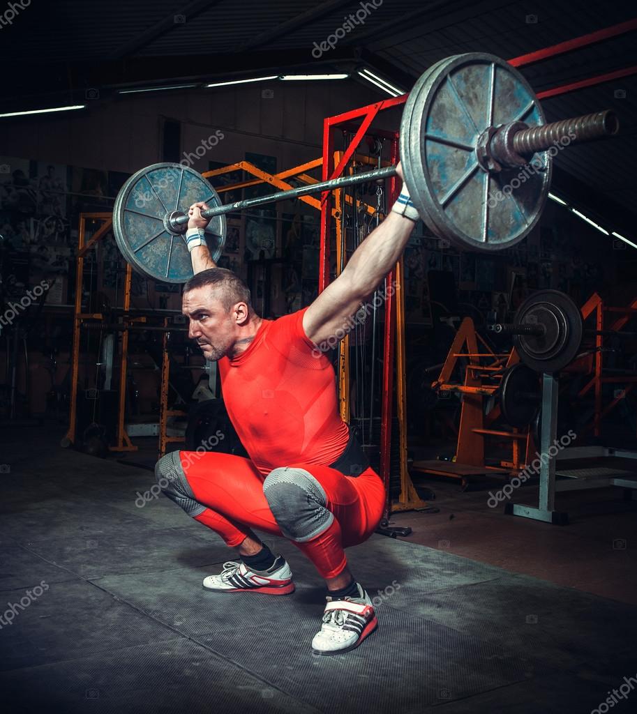 Powerlifter lifting weights Stock Photo by ©anpet2000 121535344