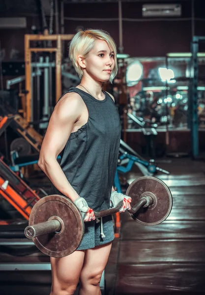 Woman working out in fitness — Stock Photo, Image