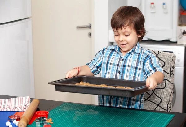 Boy Holding Baking Sheet Cookies — Stock Photo, Image