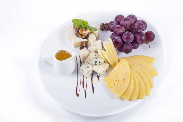 Cheese and grapes — Stock Photo, Image