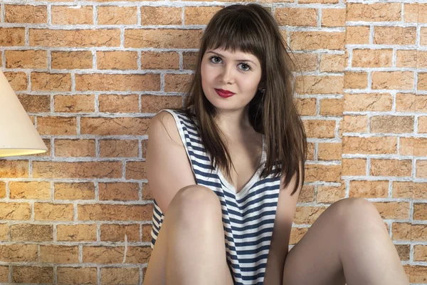 Girl near wall — Stock Photo, Image