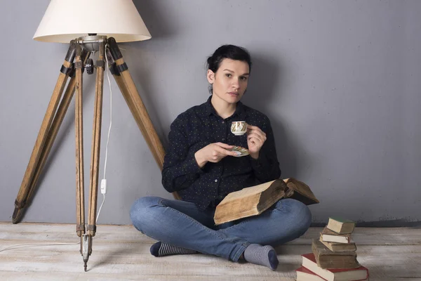 Girl with a book and coffee — Stock Photo, Image