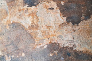 Turuncu, kahverengi ve gri tonlarına sahip doğal kayrak dokusunun soyut yukarıdan aşağı görüntüsü, arka plan için mükemmel..