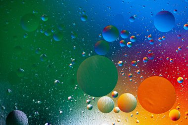 Renkli sıvı kabarcıklar makro desen parlak daireler ile soyut gradyan arkaplan oluşturur