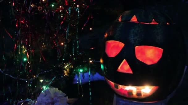 Halloweens watermelon under the christmas tree — Stock Video