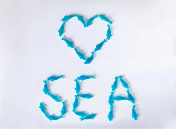 Dulces de mermelada. Palabra SEA y forma del corazón — Foto de Stock