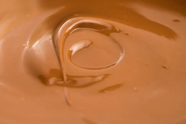 Tło stopionej czekolady mlecznej — Zdjęcie stockowe