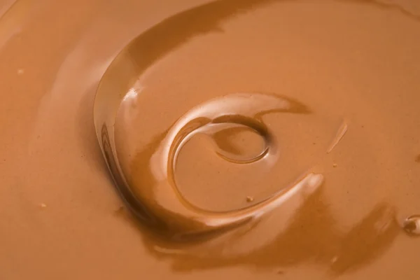 Erimiş sütlü çikolatanın arka planı — Stok fotoğraf
