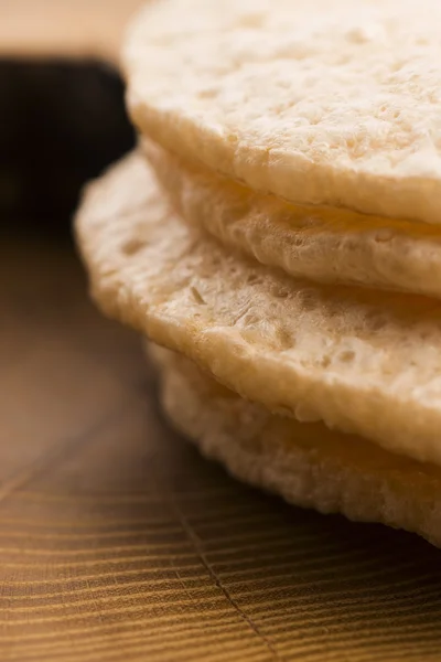 Light wheat crispers on wooden background — Stock Photo, Image