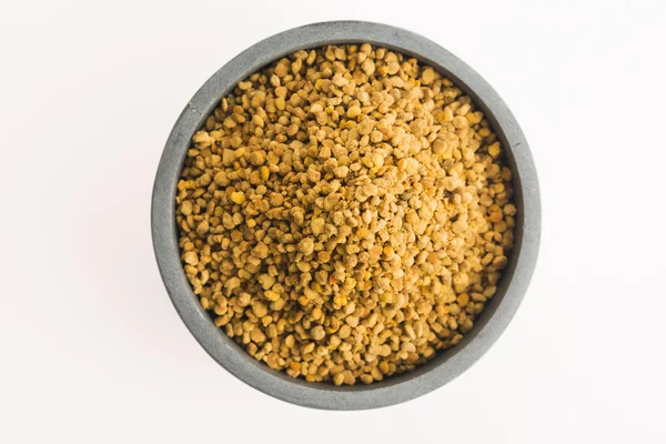 Bee pollen in bowl — Stock Photo, Image