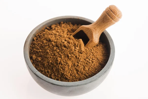 Carob powder in bowl — Stock Photo, Image