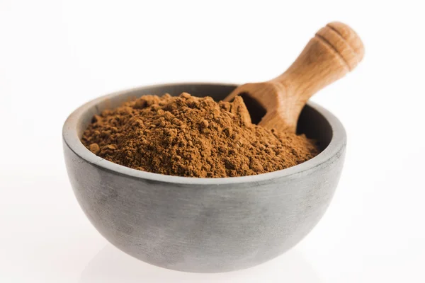 Carob powder in bowl — Stock Photo, Image