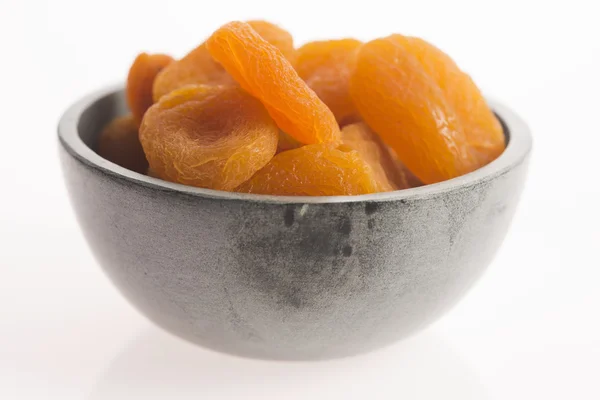 Delicious dried apricots in a bowl — Stock Photo, Image