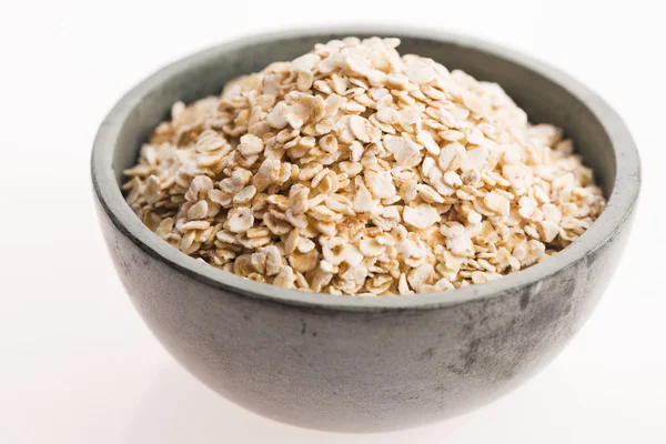 Oat flakes in bowl — Stock Photo, Image