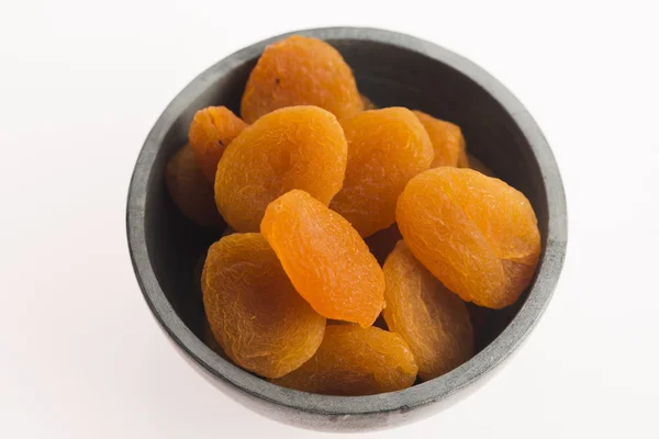 Delicious dried apricots in a bowl — Stock Photo, Image