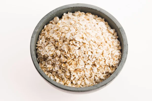 Oat flakes in bowl — Stock Photo, Image