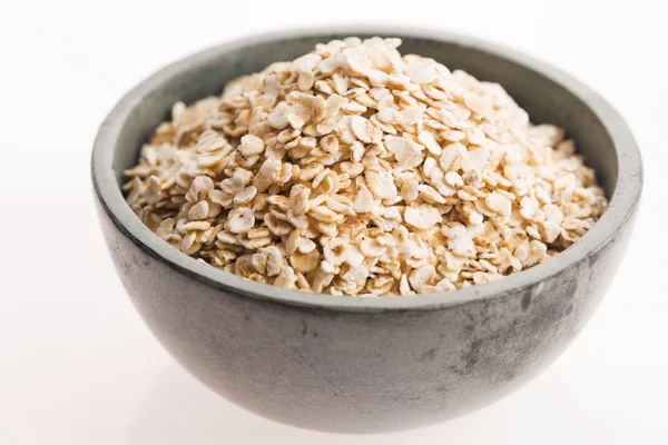 Oat flakes in bowl Royalty Free Stock Images