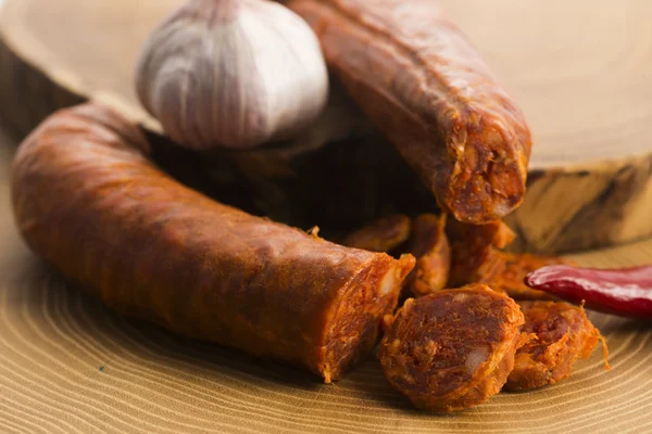 Spanish traditional chorizo sausage, with fresh herbs — Stock Photo, Image