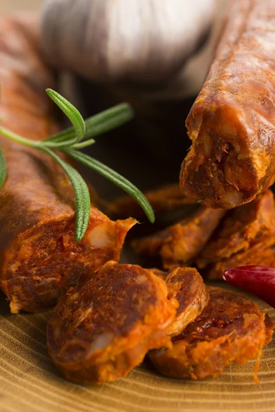 Spanish traditional chorizo sausage, with fresh herbs — Stock Photo, Image