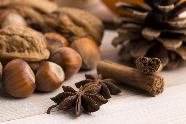 Different kinds of spices, nuts and dried oranges - christmas de — Stock Photo, Image