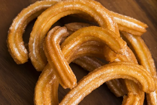 Deliciuos spanische Churros lizenzfreie Stockbilder